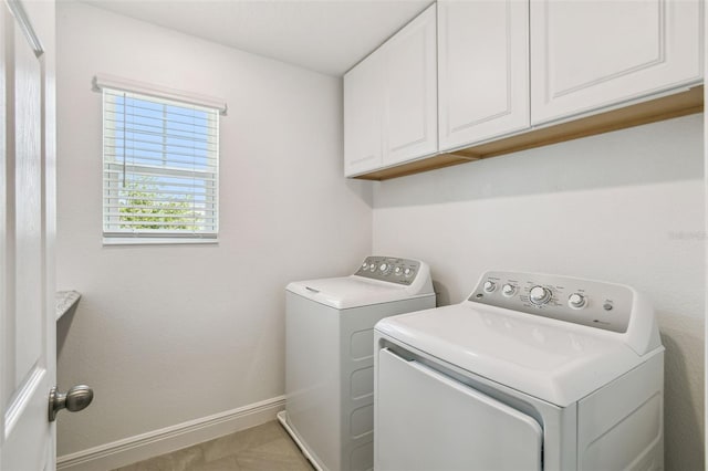 4950 Chase Ct, Saint Cloud, FL 34772 - laundry room featuring cabinet space, washer and clothes dryer, and baseboards