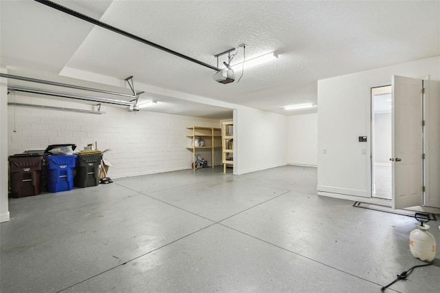 4950 Chase Ct, Saint Cloud, FL 34772 - garage with a garage door opener, baseboards, and concrete block wall