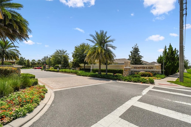 4950 Chase Ct, Saint Cloud, FL 34772 - view of asphalt street featuring street lights and curbs