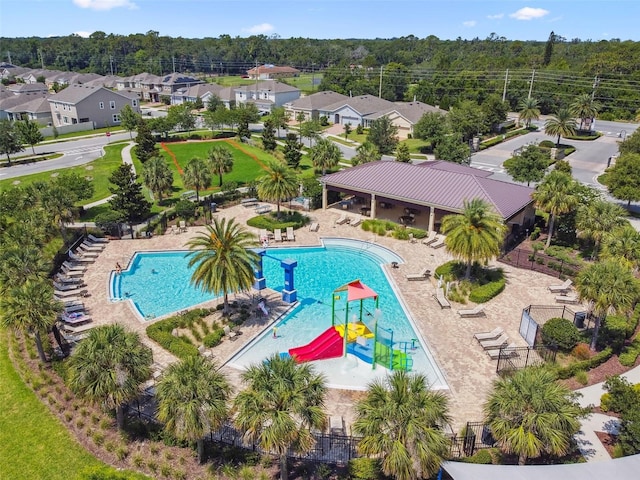 4950 Chase Ct, Saint Cloud, FL 34772 - community pool with a water play area, a water slide, and a residential view