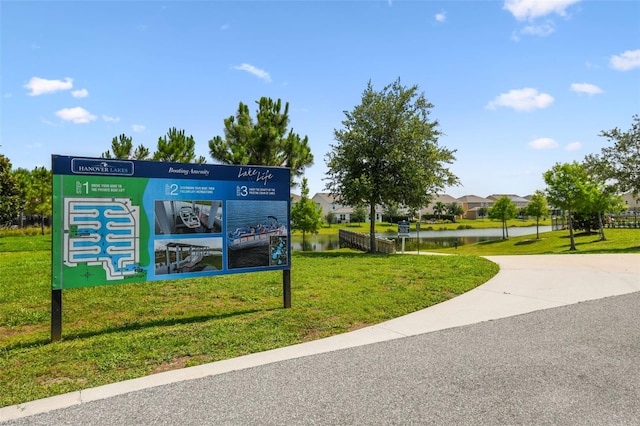 4950 Chase Ct, Saint Cloud, FL 34772 - surrounding community featuring a lawn and a water view