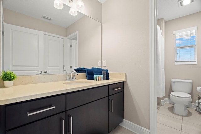 1520 W Fig St, Tampa, FL 33606 - bathroom with vanity, toilet, baseboards, and tile patterned flooring