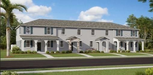 1829 Fulfillment Dr, Kissimmee, FL 34744 - colonial-style house featuring a front yard