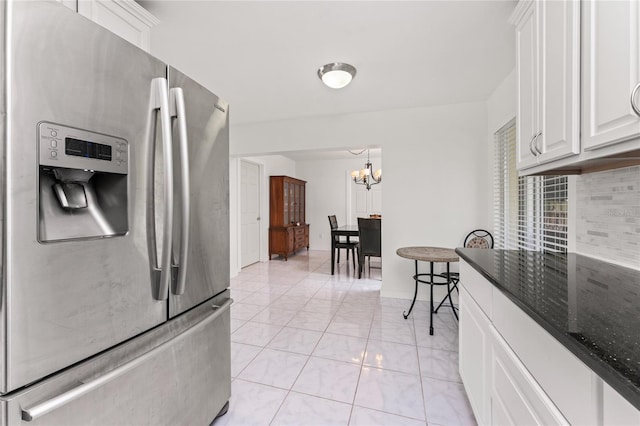 3420 Santa Clara Dr, Punta Gorda, FL 33983 - kitchen featuring stainless steel refrigerator with ice dispenser, a chandelier, white cabinetry, and dark stone counters