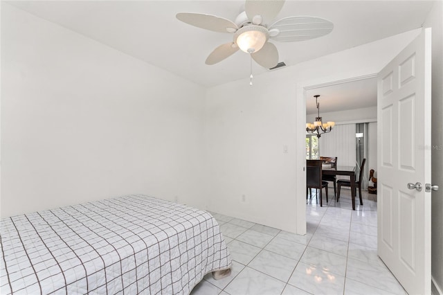 3420 Santa Clara Dr, Punta Gorda, FL 33983 - bedroom featuring a chandelier and a ceiling fan