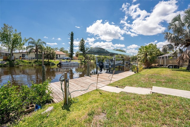 3420 Santa Clara Dr, Punta Gorda, FL 33983 - dock area featuring boat lift, a lawn, and a water view