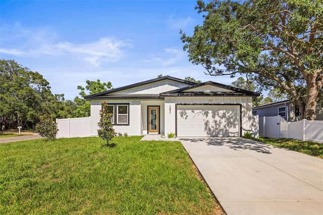 ranch-style house with an attached garage and concrete driveway