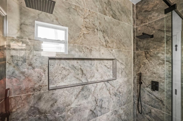 full bath with tiled shower