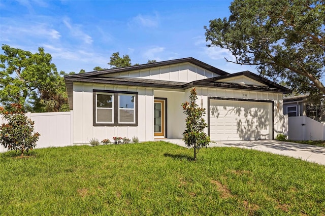 view of front of property featuring board and batten siding, a garage, and driveway