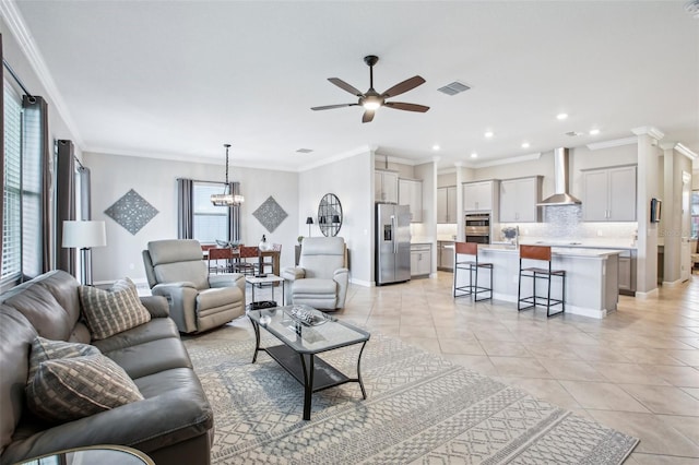 31510 Cabana Rye Ave, San Antonio, FL 33576 - living room featuring plenty of natural light, a ceiling fan, ornamental molding, light tile patterned floors, and recessed lighting