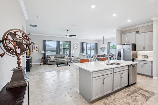 31510 Cabana Rye Ave, San Antonio, FL 33576 - kitchen with stainless steel appliances, crown molding, light countertops, ceiling fan, and gray cabinets