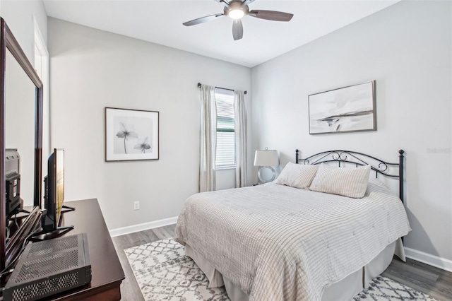 31510 Cabana Rye Ave, San Antonio, FL 33576 - bedroom featuring wood finished floors, a ceiling fan, and an office area