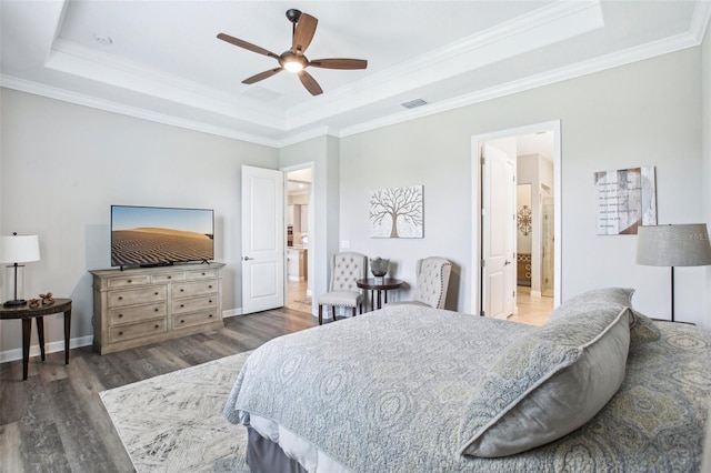 31510 Cabana Rye Ave, San Antonio, FL 33576 - bedroom featuring a tray ceiling, wood finished floors, crown molding, ensuite bathroom, and ceiling fan