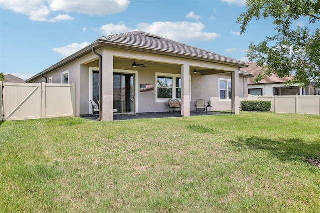 31510 Cabana Rye Ave, San Antonio, FL 33576 - rear view of property featuring a ceiling fan, a patio, stucco siding, and a fenced backyard