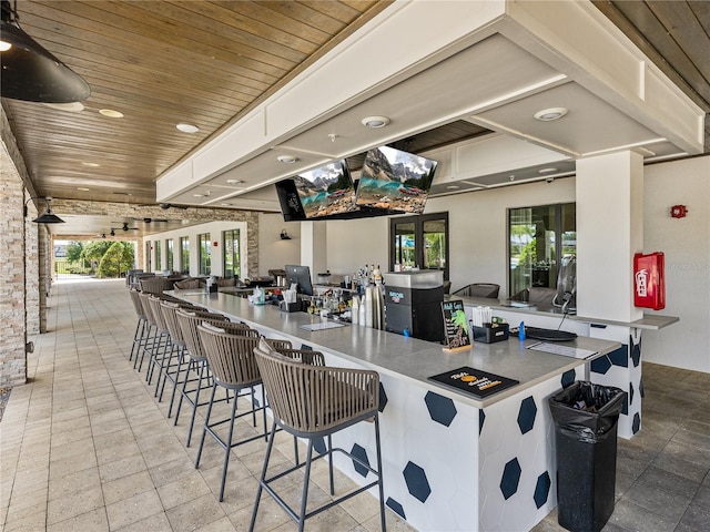 31510 Cabana Rye Ave, San Antonio, FL 33576 - kitchen featuring wood ceiling, recessed lighting, a kitchen breakfast bar, french doors, and open floor plan