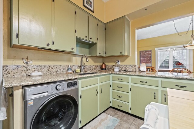 916 E Broad St, Tampa, FL 33604 - laundry area with washer / dryer, a sink, and light tile patterned floors