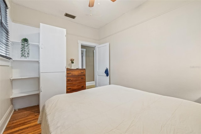 916 E Broad St, Tampa, FL 33604 - bedroom with wood finished floors, baseboards, and ceiling fan