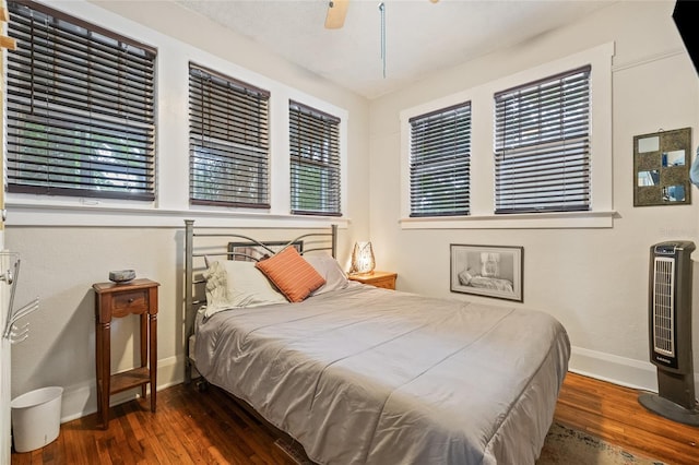 916 E Broad St, Tampa, FL 33604 - bedroom with wood-type flooring, baseboards, and a ceiling fan