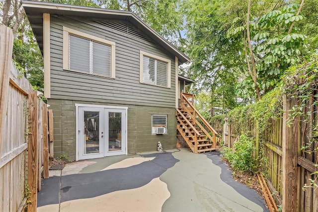 916 E Broad St, Tampa, FL 33604 - rear view of property with a patio, french doors, a fenced backyard, and stairs