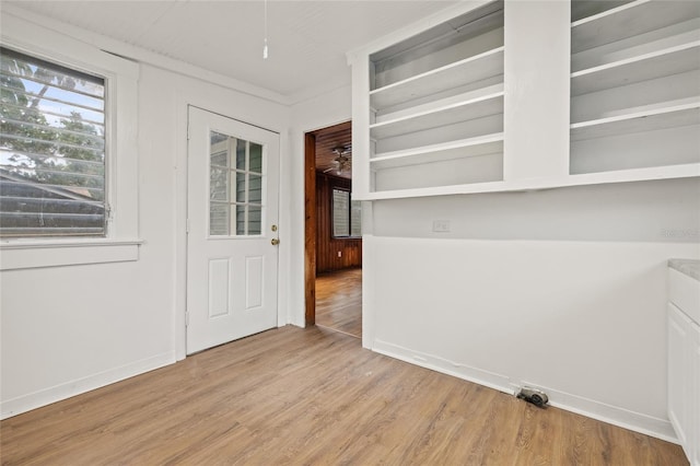 916 E Broad St, Tampa, FL 33604 - unfurnished dining area with light wood finished floors and baseboards