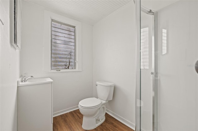 916 E Broad St, Tampa, FL 33604 - full bathroom featuring wood finished floors, a shower stall, toilet, baseboards, and vanity