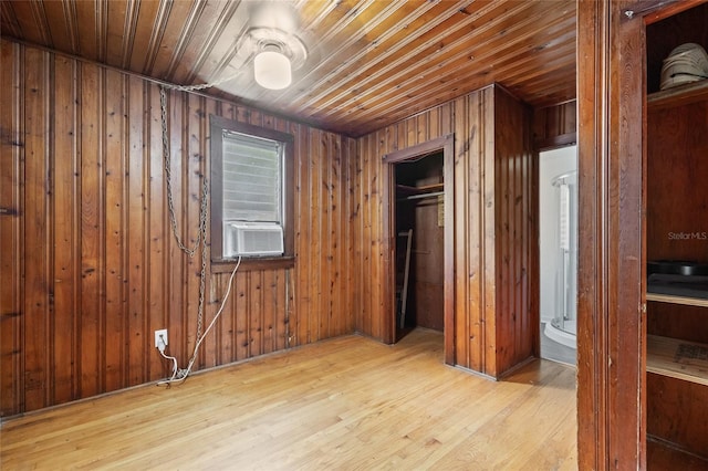 916 E Broad St, Tampa, FL 33604 - unfurnished bedroom featuring cooling unit, wood finished floors, a closet, wooden walls, and wooden ceiling