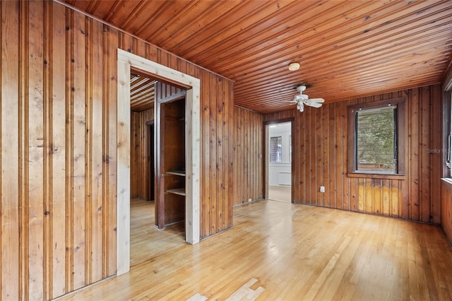 916 E Broad St, Tampa, FL 33604 - spare room with a ceiling fan, wooden ceiling, wood finished floors, and wood walls