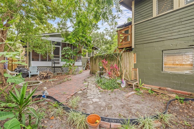 916 E Broad St, Tampa, FL 33604 - view of yard with a sunroom and fence