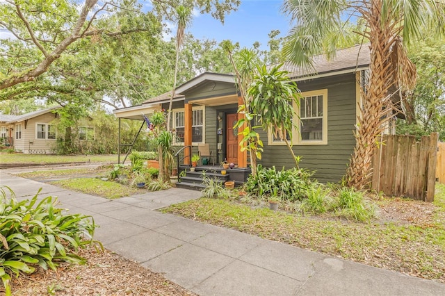 916 E Broad St, Tampa, FL 33604 - bungalow-style home featuring an attached carport, fence, and driveway