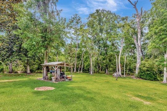 view of green lawn featuring a gazebo