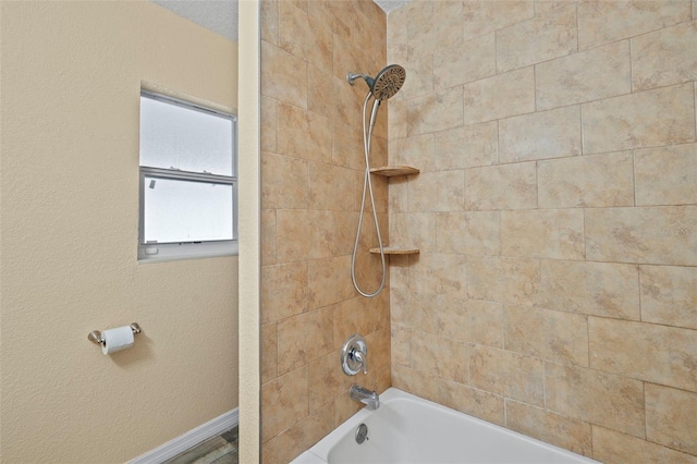 bathroom with tub / shower combination