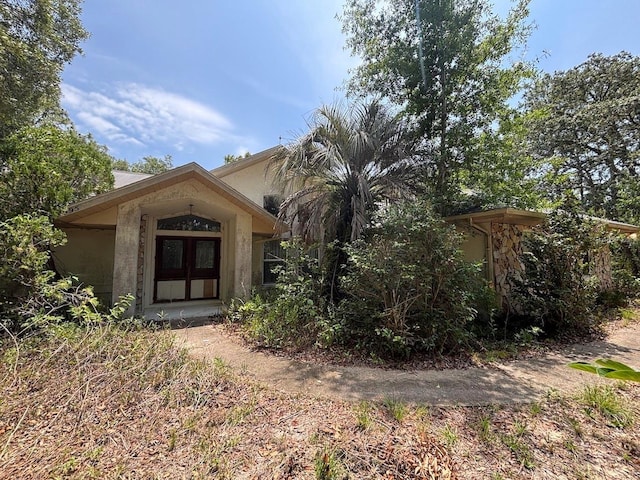 2995 N Bravo Dr, Beverly Hills, FL 34465 - obstructed view of property with stucco siding