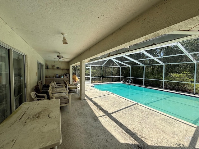 2995 N Bravo Dr, Beverly Hills, FL 34465 - swimming pool featuring a patio area, glass enclosure, and a ceiling fan