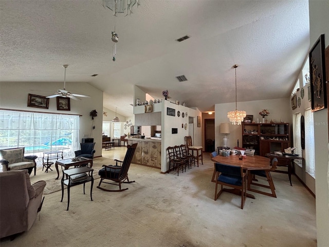 2995 N Bravo Dr, Beverly Hills, FL 34465 - dining area with vaulted ceiling, a chandelier, ceiling fan, a textured ceiling, and light colored carpet