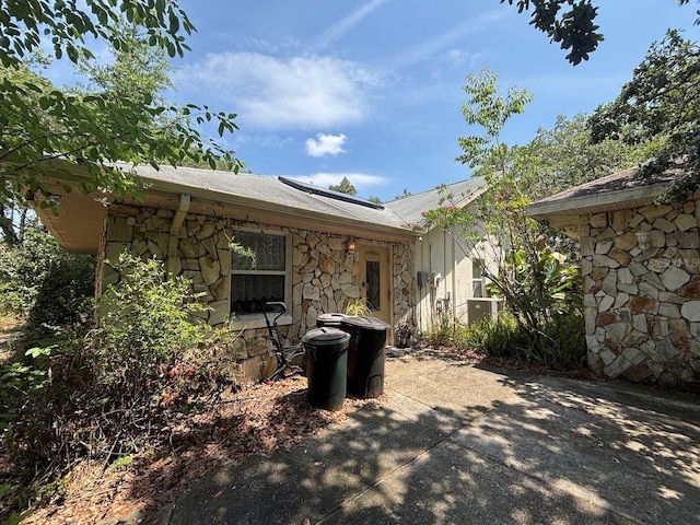 2995 N Bravo Dr, Beverly Hills, FL 34465 - back of property featuring stone siding and a patio area