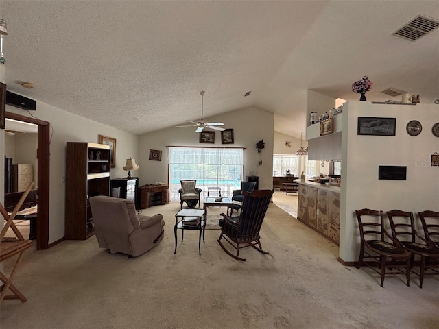 2995 N Bravo Dr, Beverly Hills, FL 34465 - dining room featuring light carpet, a ceiling fan, lofted ceiling, and a textured ceiling