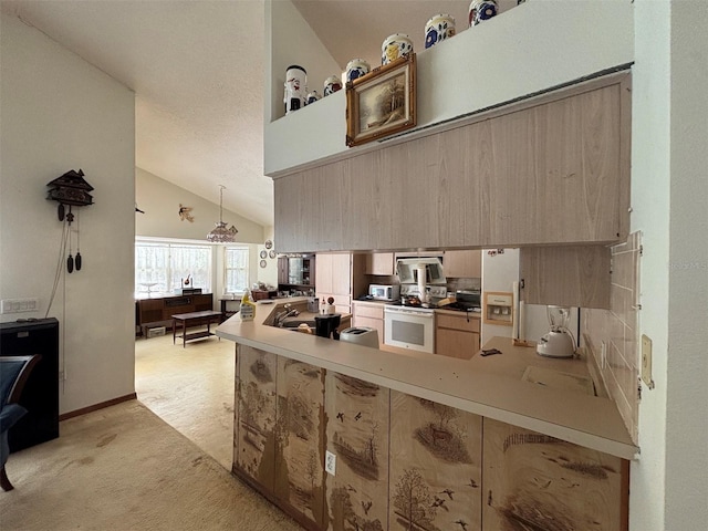 2995 N Bravo Dr, Beverly Hills, FL 34465 - kitchen with white appliances, light carpet, vaulted ceiling, a peninsula, and light brown cabinetry