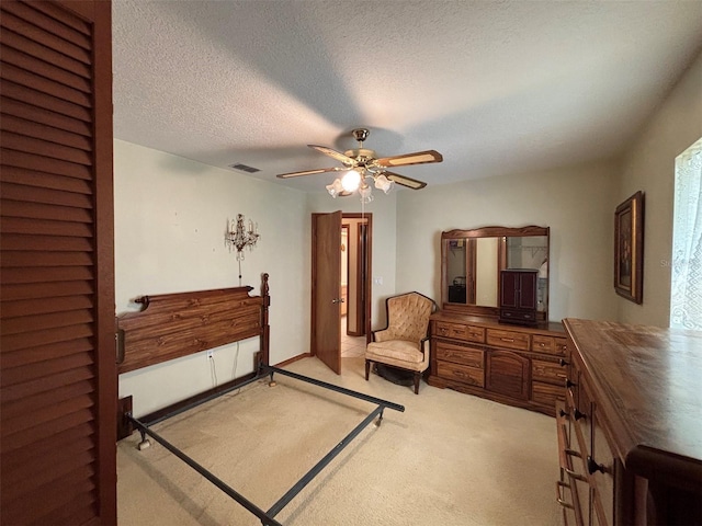 2995 N Bravo Dr, Beverly Hills, FL 34465 - bedroom featuring light colored carpet, ceiling fan, and a textured ceiling