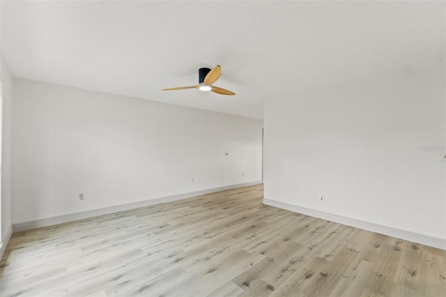 7400 Belvedere Ter, New Port Richey, FL 34655 - spare room with light wood finished floors, a ceiling fan, and baseboards