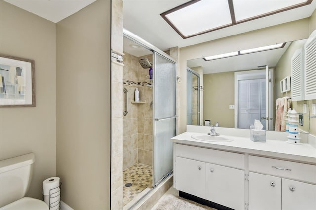 10216 Regal Dr Unit 310, Largo, FL 33774 - bathroom with a stall shower, vanity, and toilet
