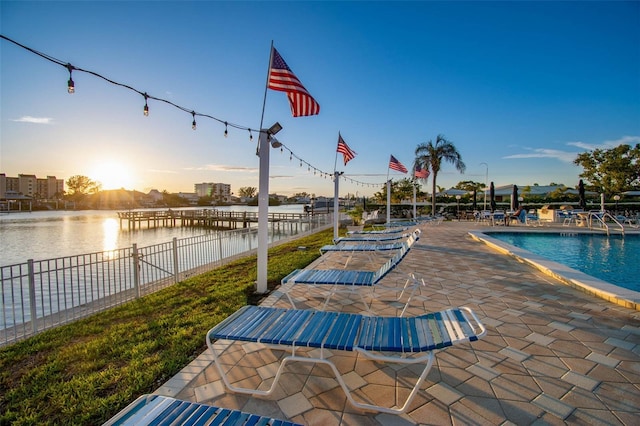 10216 Regal Dr Unit 310, Largo, FL 33774 - community pool featuring a patio area, a water view, and fence
