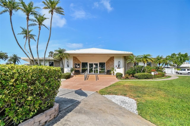 10216 Regal Dr Unit 310, Largo, FL 33774 - view of front of home with a front lawn and stucco siding