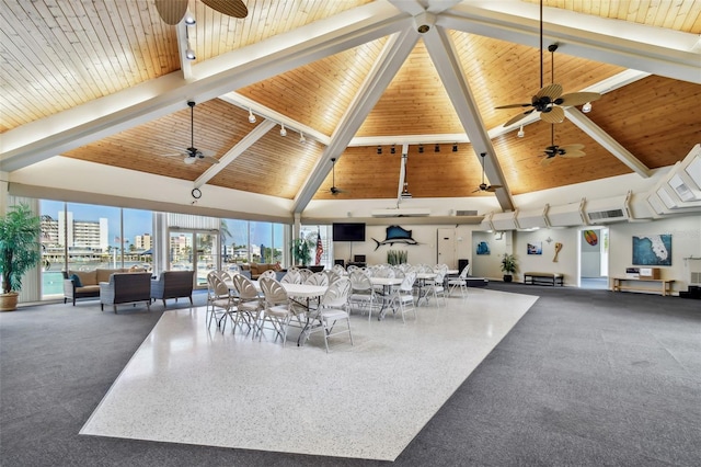 10216 Regal Dr Unit 310, Largo, FL 33774 - dining area with ceiling fan, a high ceiling, beamed ceiling, and wooden ceiling