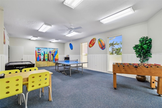 10216 Regal Dr Unit 310, Largo, FL 33774 - rec room with wainscoting, carpet floors, and ceiling fan