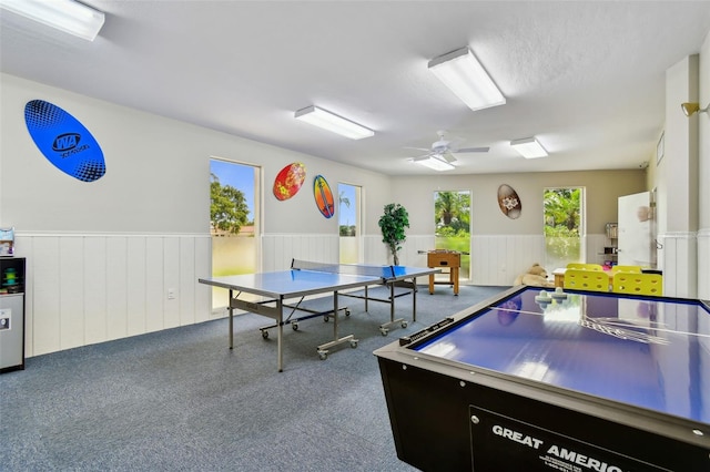 10216 Regal Dr Unit 310, Largo, FL 33774 - rec room with a wainscoted wall, carpet, and ceiling fan