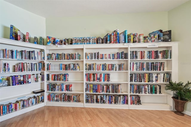 10216 Regal Dr Unit 310, Largo, FL 33774 - living area with bookshelves and wood finished floors