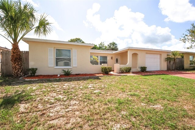 9816 Crofton Ln, Port Richey, FL 34668 - single story home with stucco siding, an attached garage, and driveway