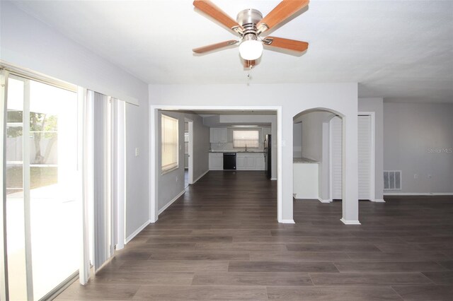9816 Crofton Ln, Port Richey, FL 34668 - hallway with arched walkways, dark wood-type flooring, and baseboards