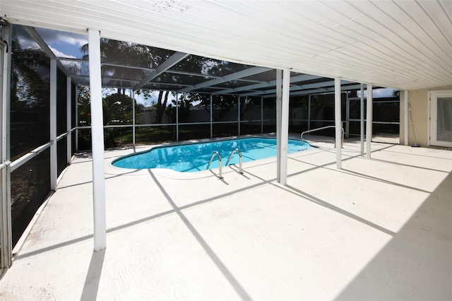 9816 Crofton Ln, Port Richey, FL 34668 - view of pool with a patio, glass enclosure, and fence