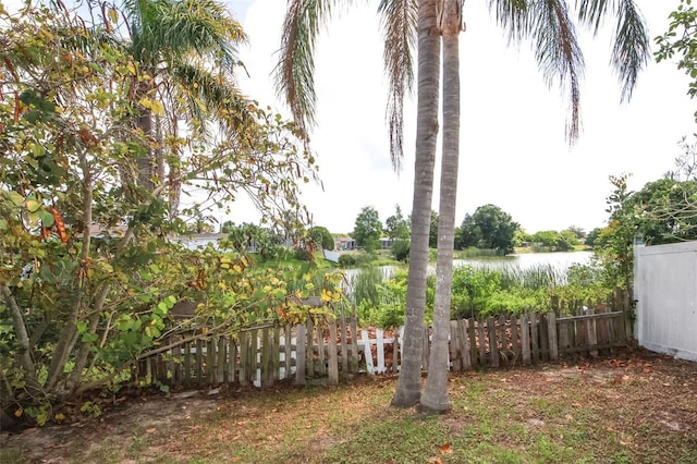 9816 Crofton Ln, Port Richey, FL 34668 - view of yard with fence and a water view